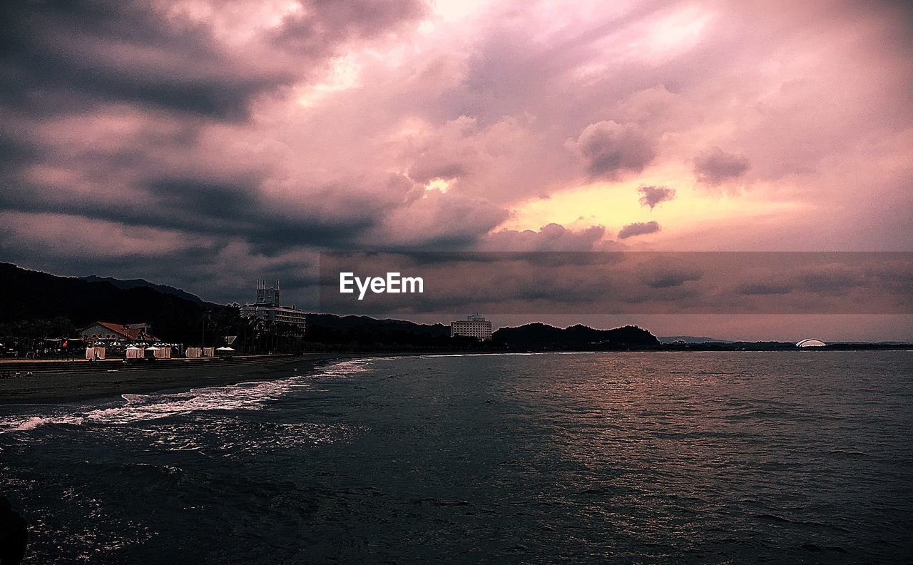 VIEW OF CLOUDY SKY AT DUSK