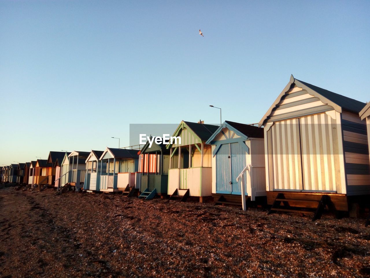 Built structure on beach against clear sky