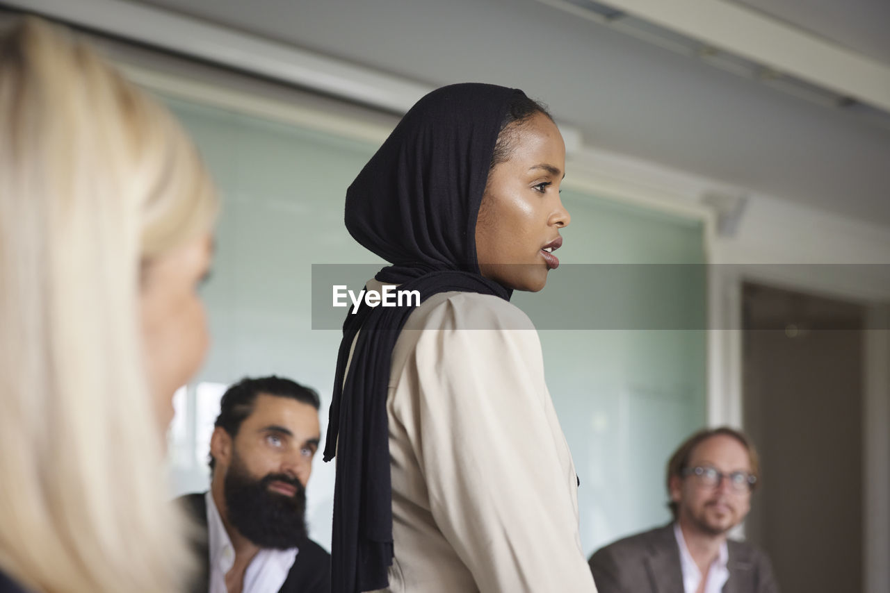 Smiling woman at business meeting