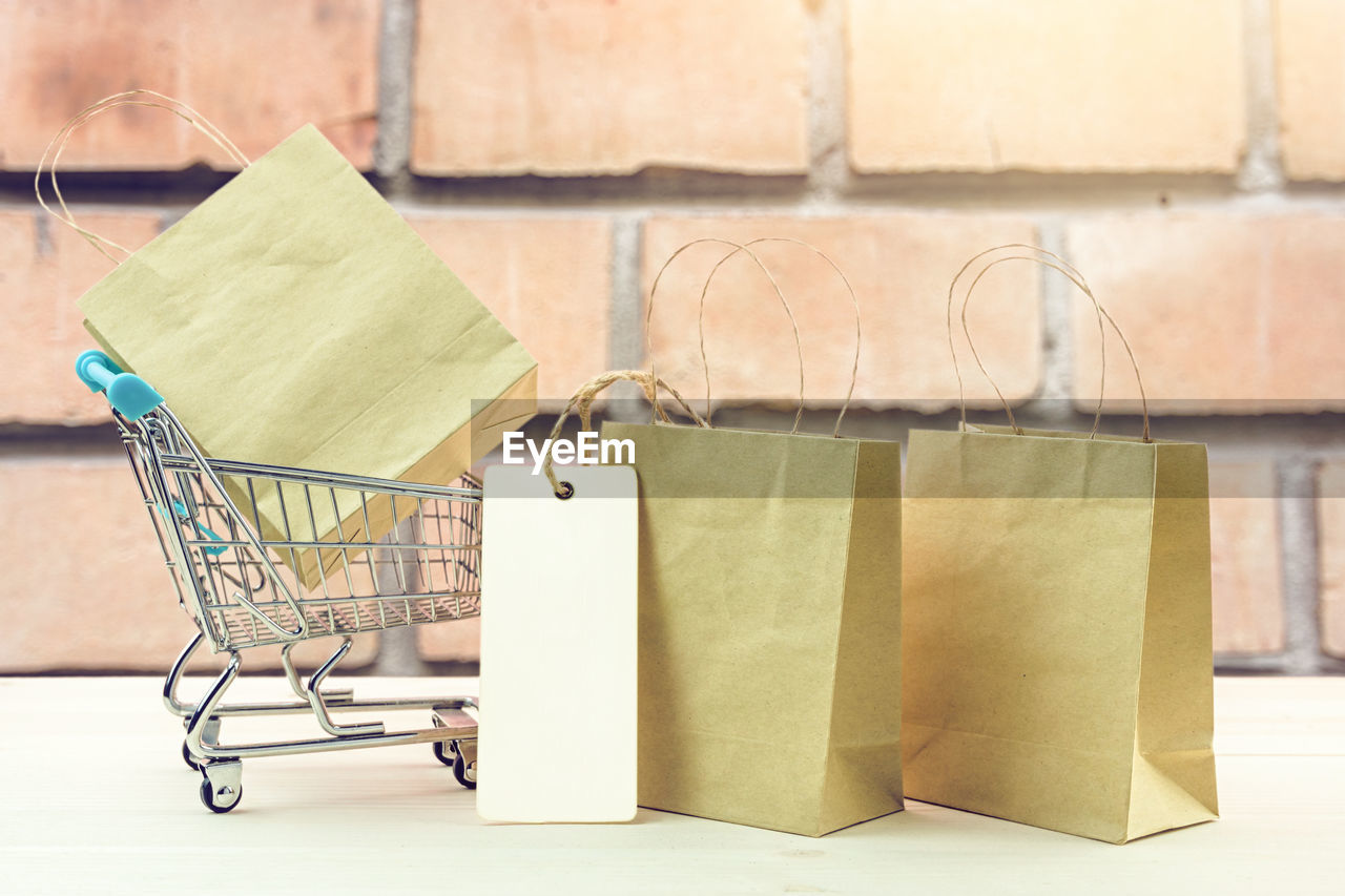 Close-up of shopping bags on table