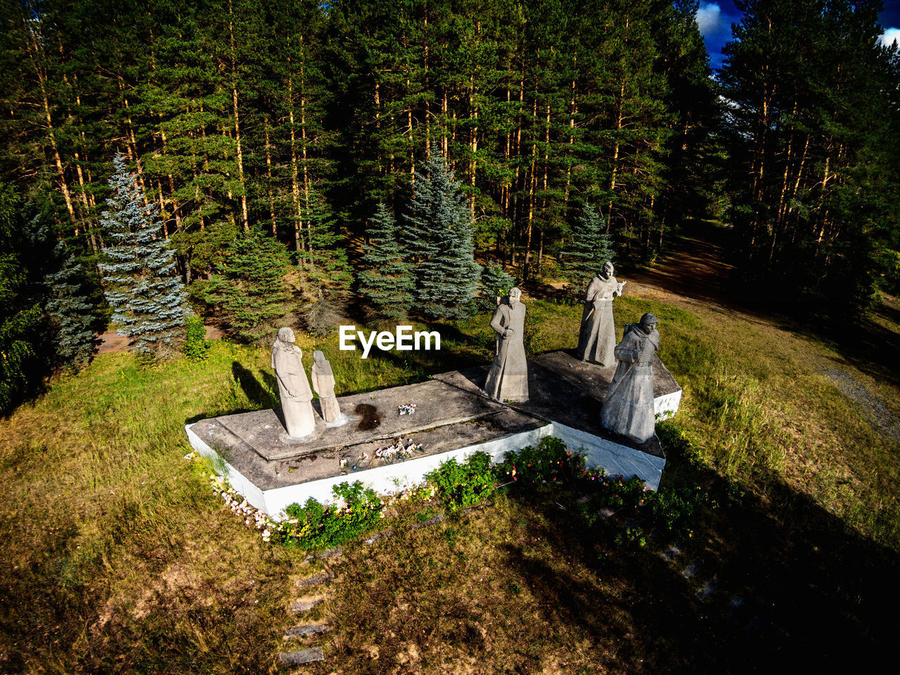 High angle view of statues against trees