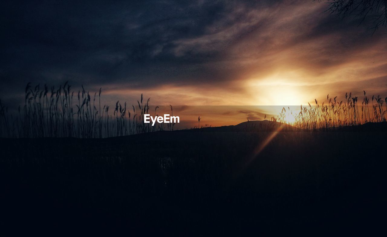 Scenic view of silhouette landscape against sky during sunset