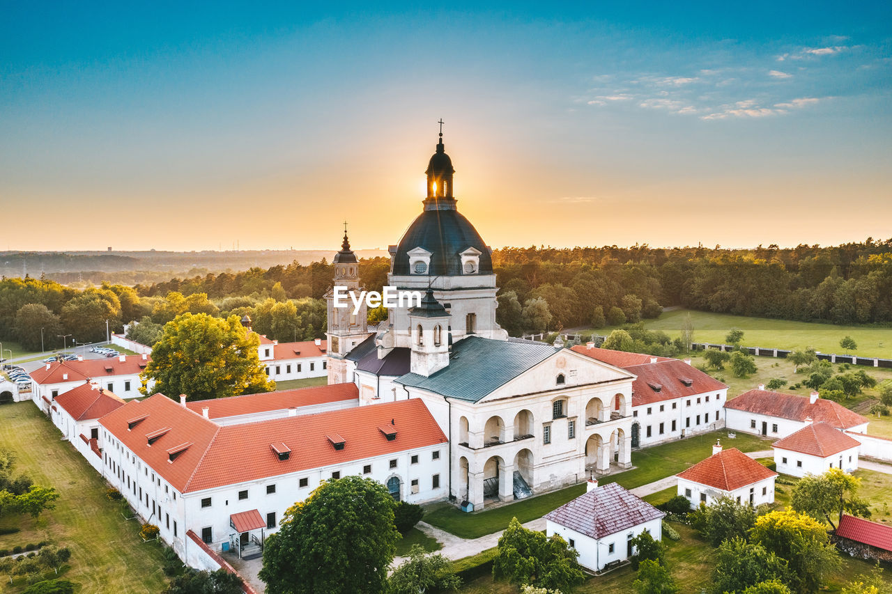 Aerial view of church against sky at sunset