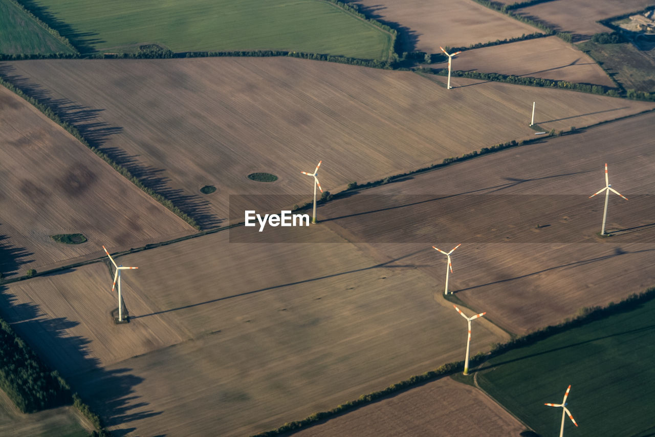 Aerial view of windmills on landscape