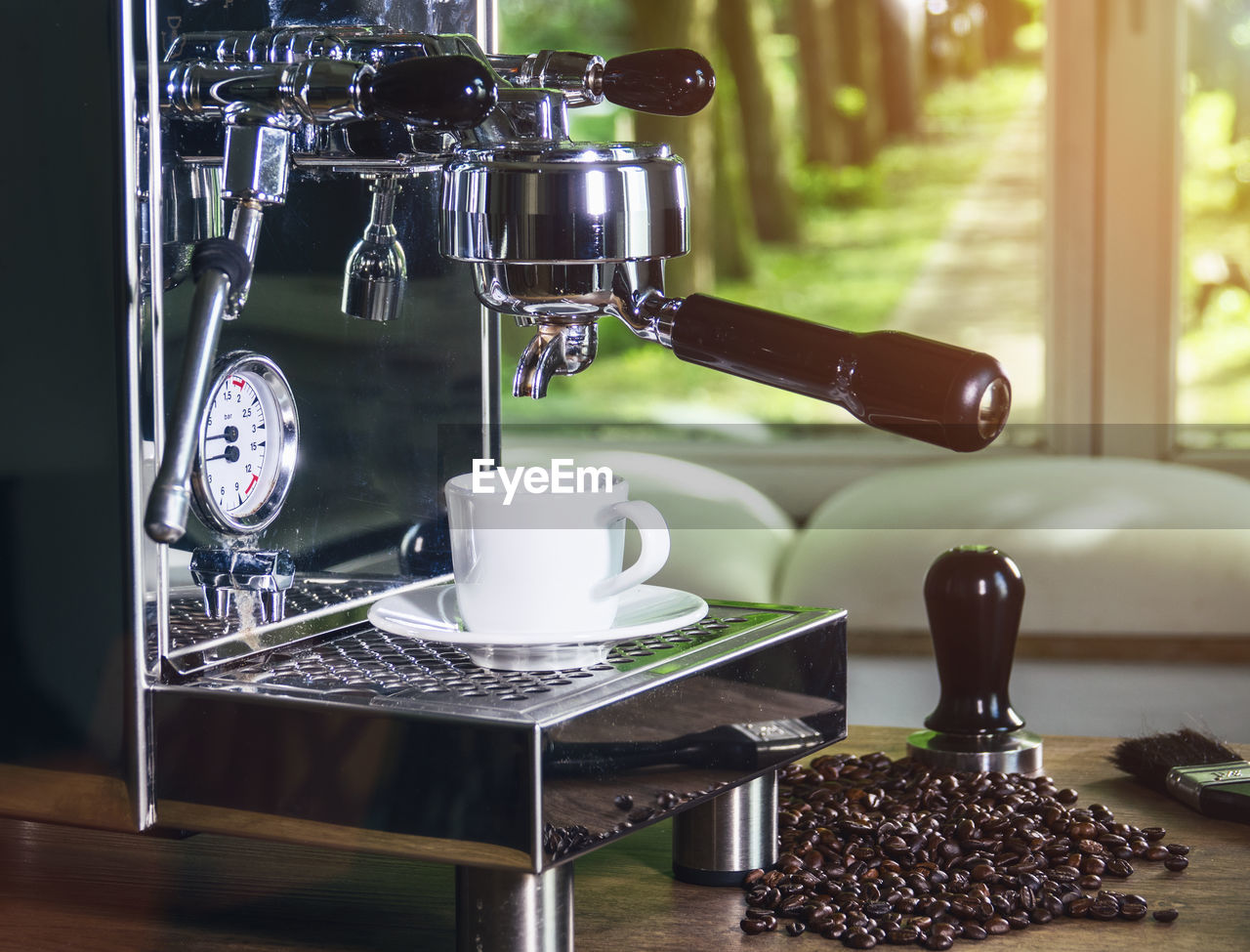 Close-up of espresso maker on table at cafe