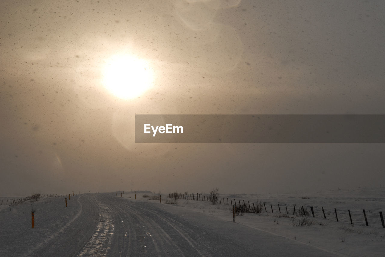 SCENIC VIEW OF ROAD DURING WINTER