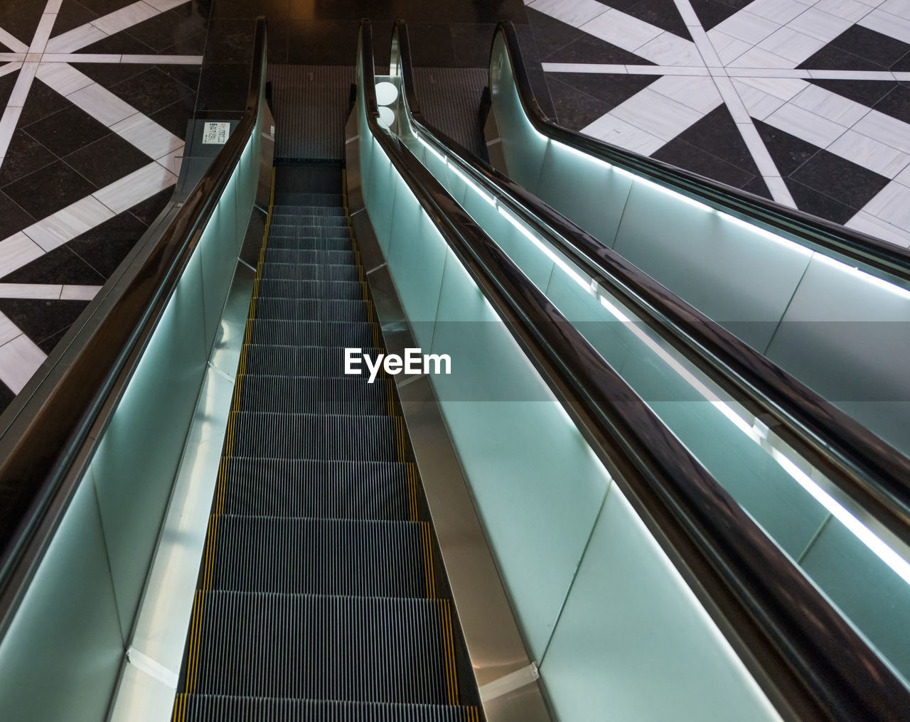 HIGH ANGLE VIEW OF ESCALATOR IN SUBWAY