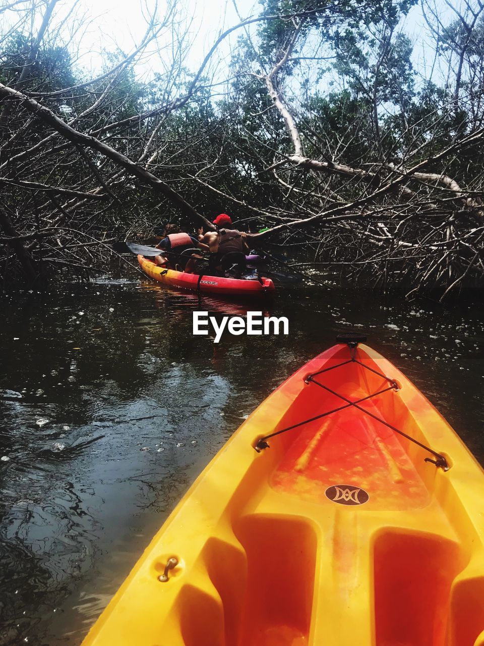 PEOPLE TRAVELING IN RIVER