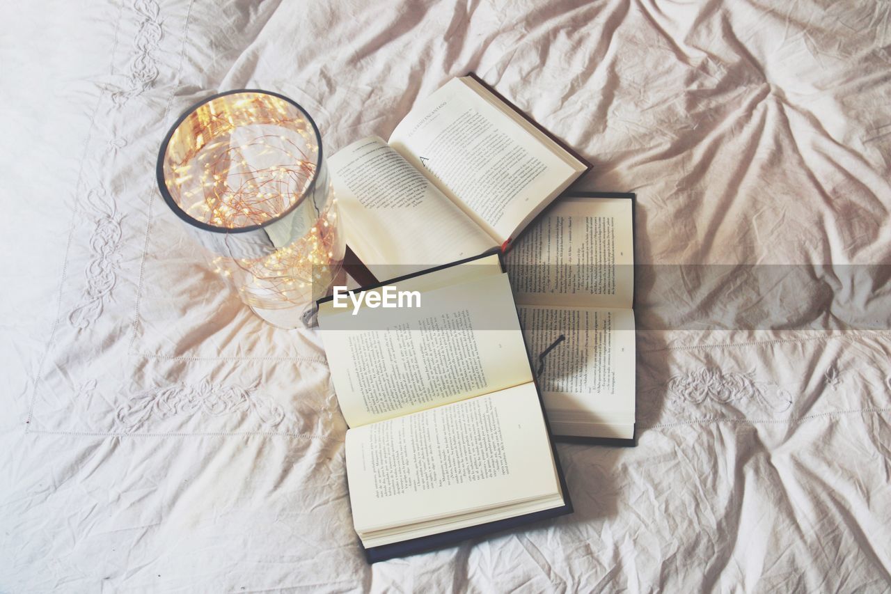 HIGH ANGLE VIEW OF BOOK ON TABLE