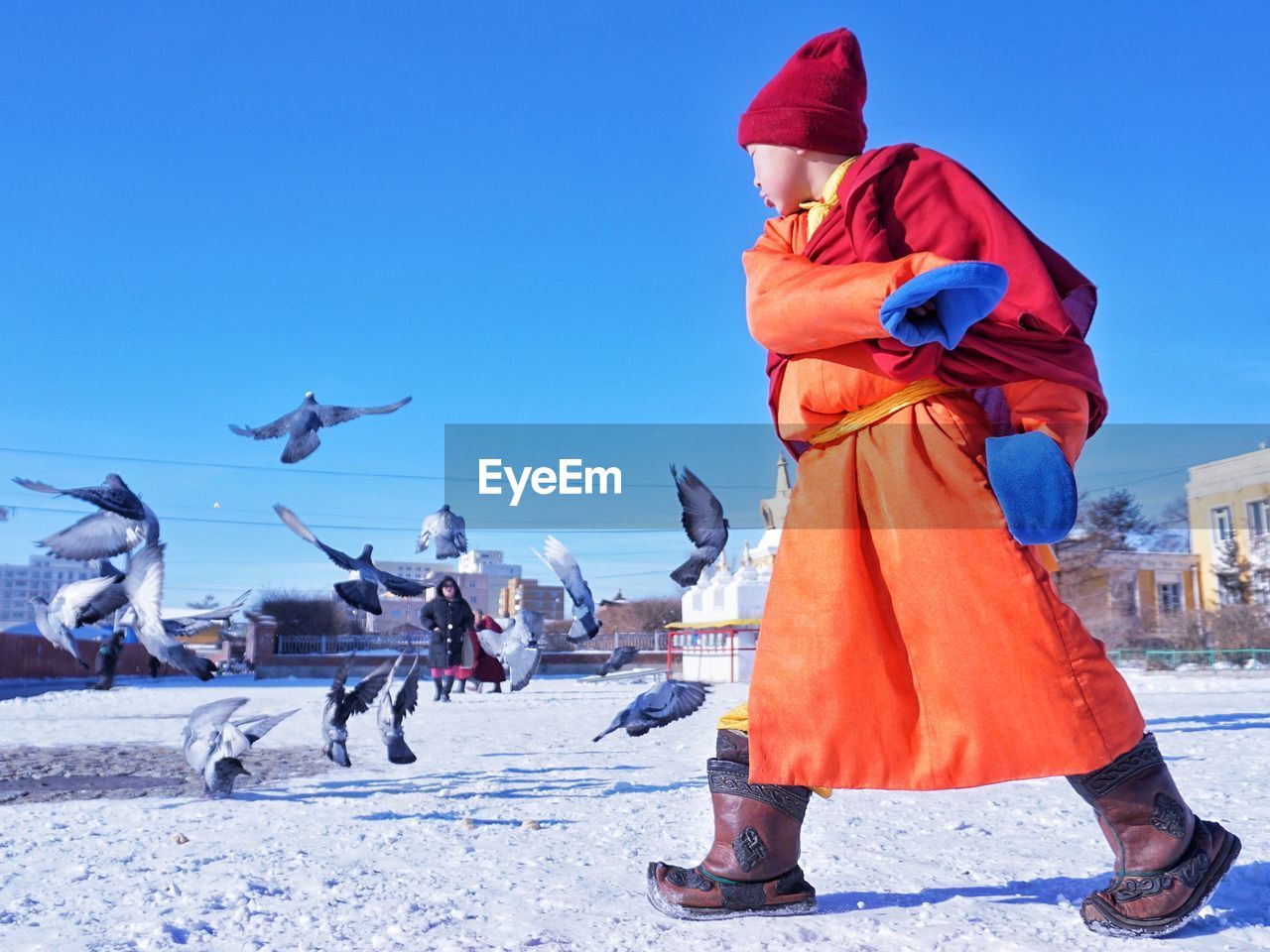 PEOPLE FLYING AGAINST BLUE SKY