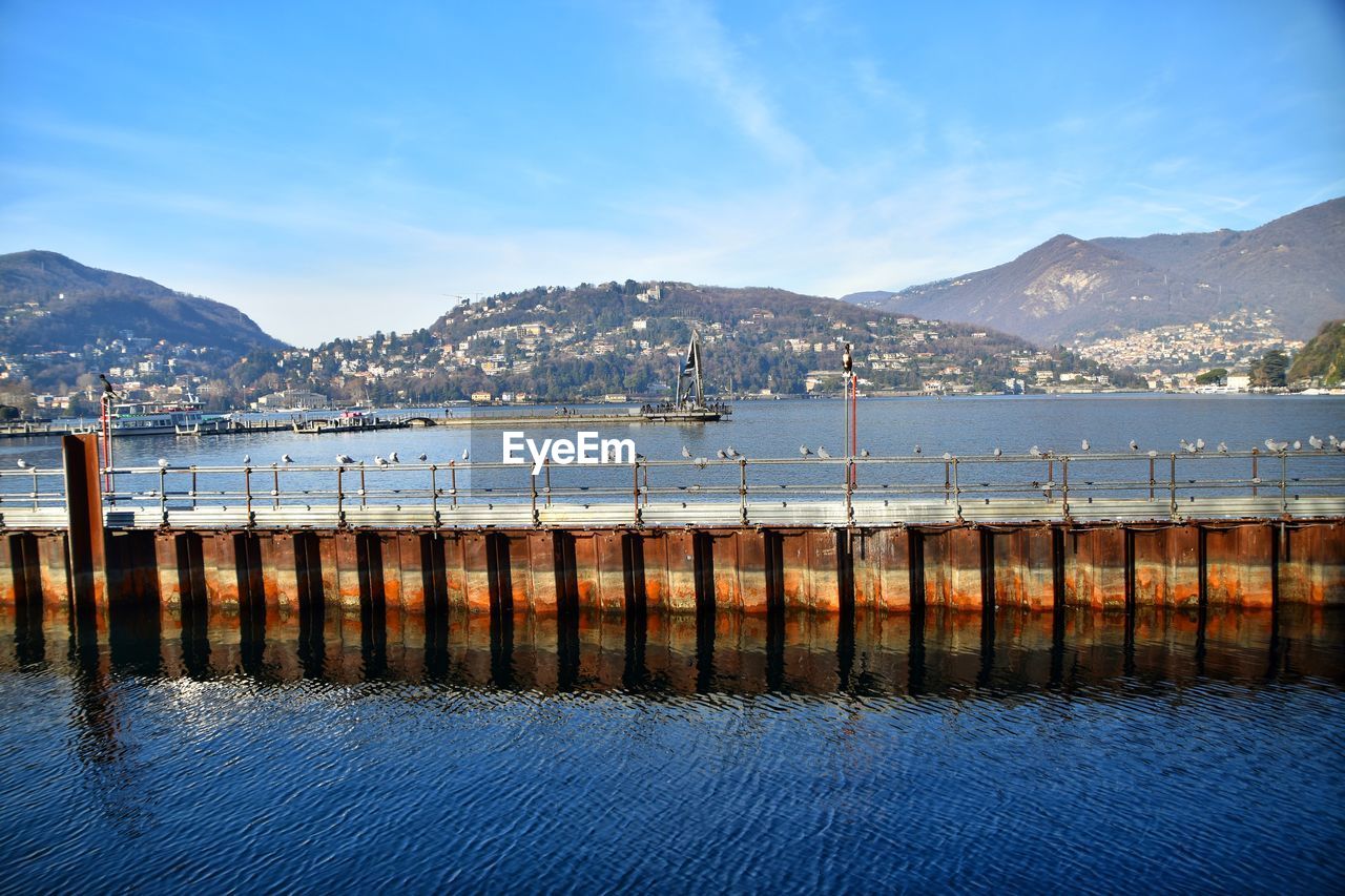 Scenic view of lake against blue sky