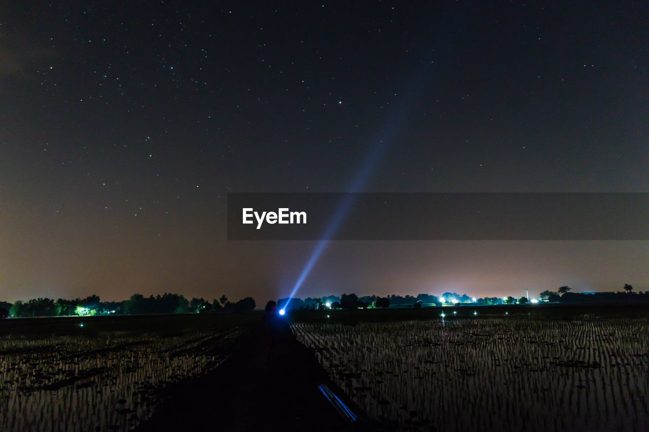 Scenic view of sky over land at night