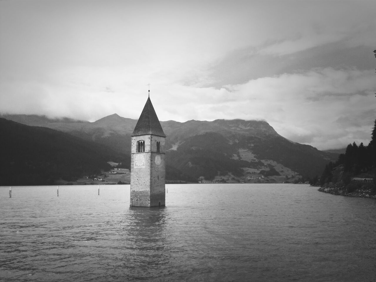Stone tower rising above of water