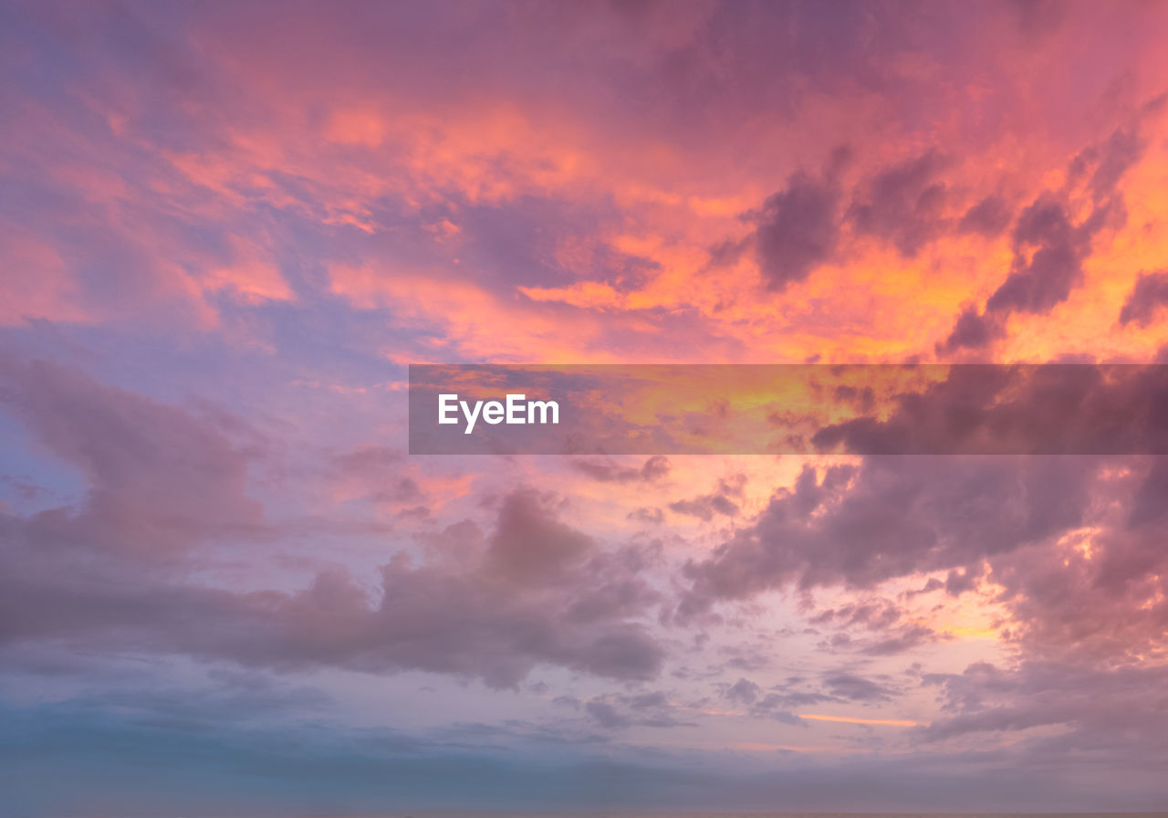 LOW ANGLE VIEW OF CLOUDY SKY AT SUNSET