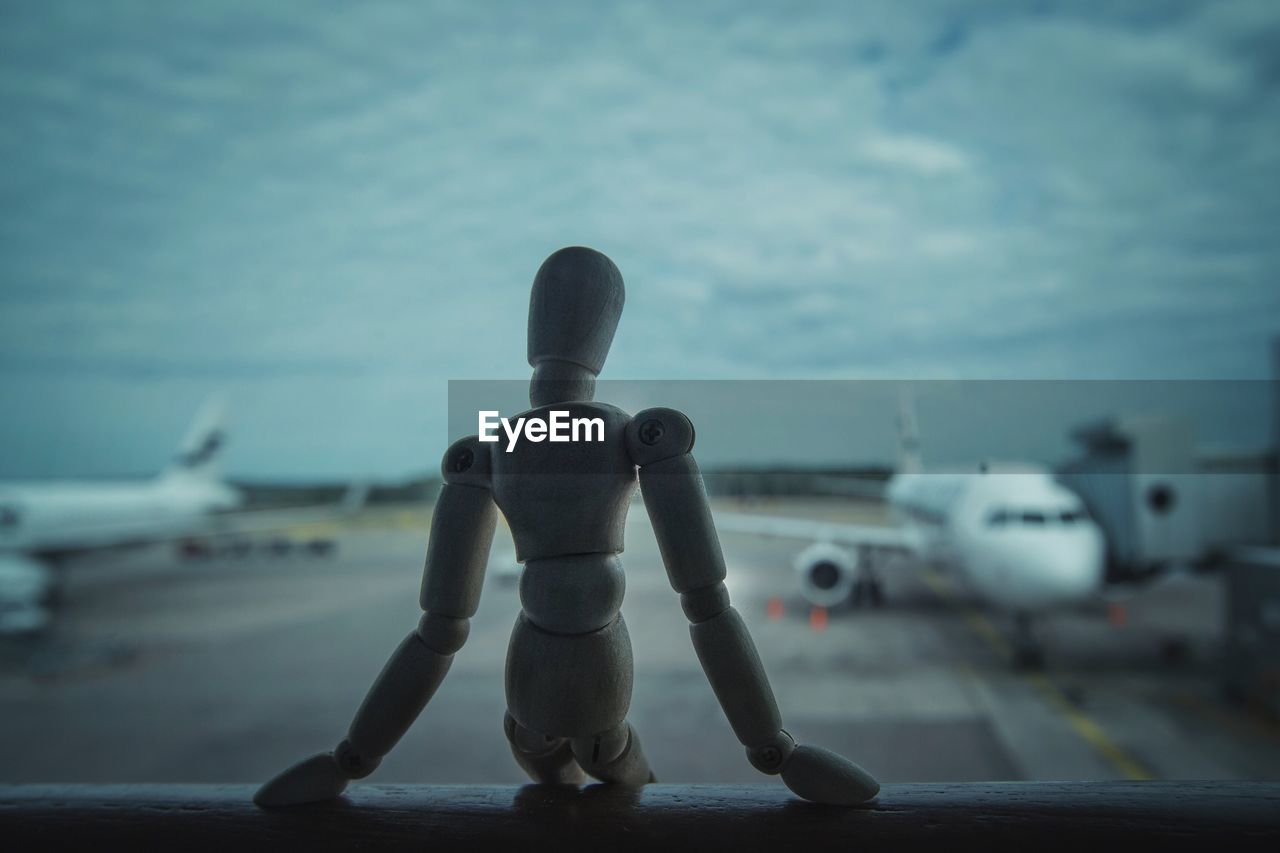 CLOSE-UP OF AIRPLANE ON AIRPORT RUNWAY