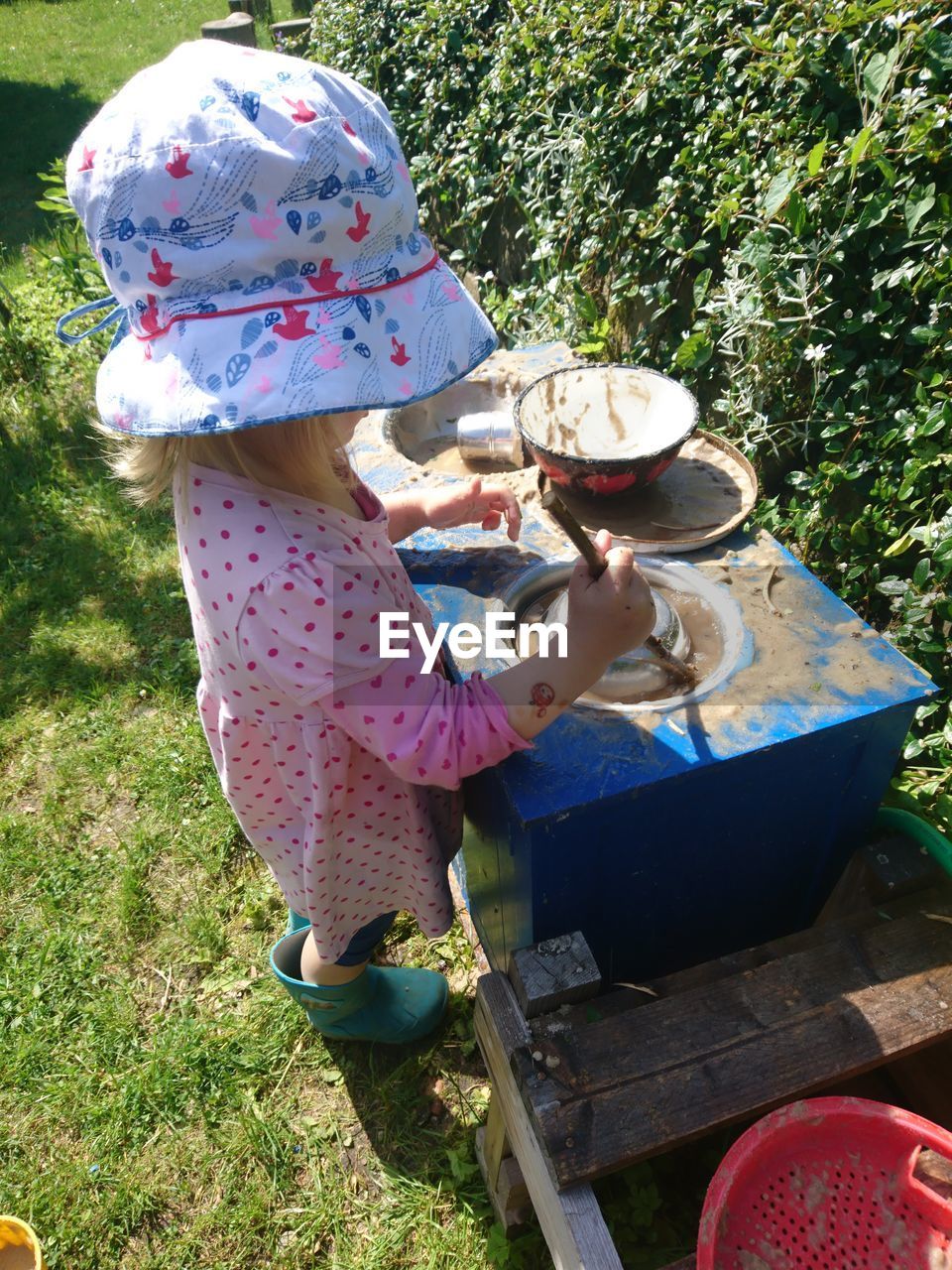 Side view of girl playing at yard