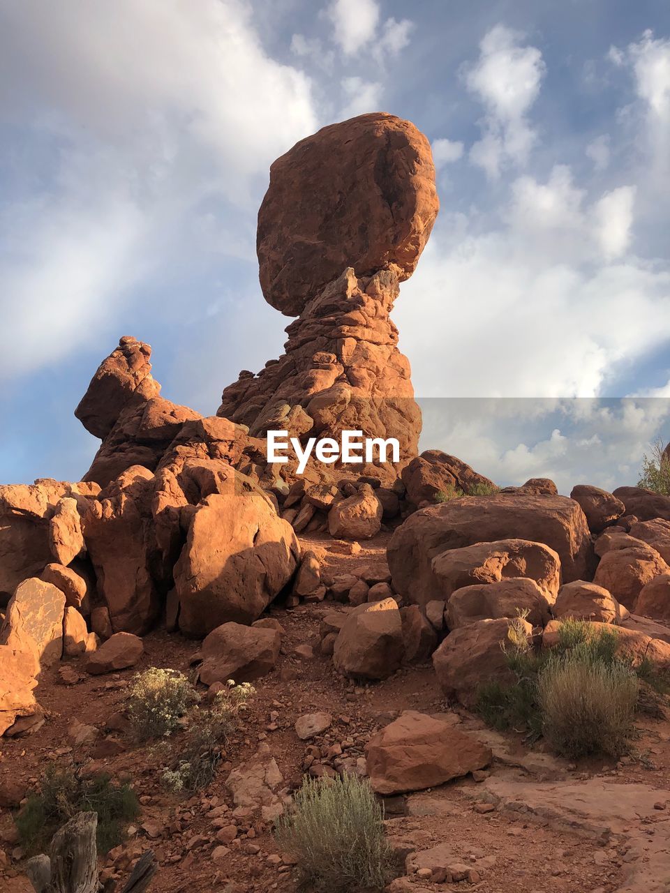 ROCKS ON LAND AGAINST SKY