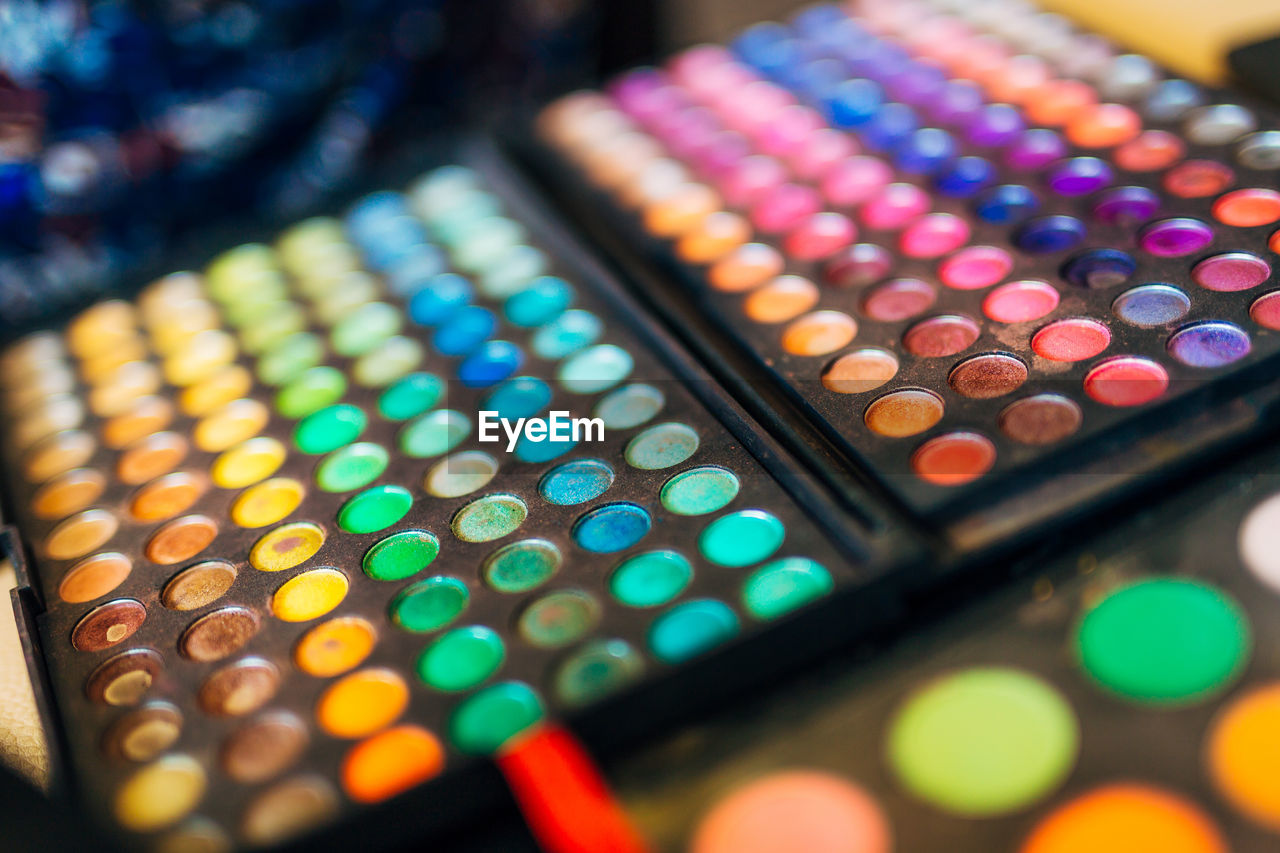 Close-up of multi colored make-up products