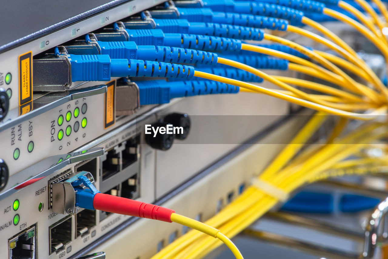 Optical line terminal with connected fiber optic patch cords close-up