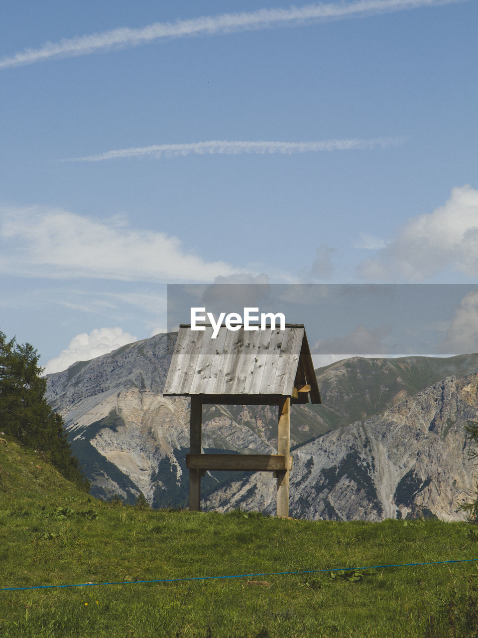 Built structure on field against sky