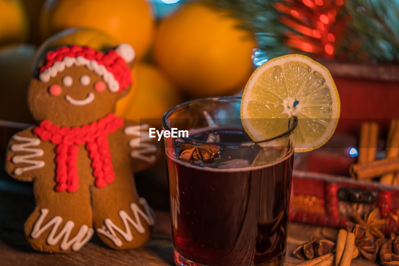 Close-up of drink and gingerbread cookie on table