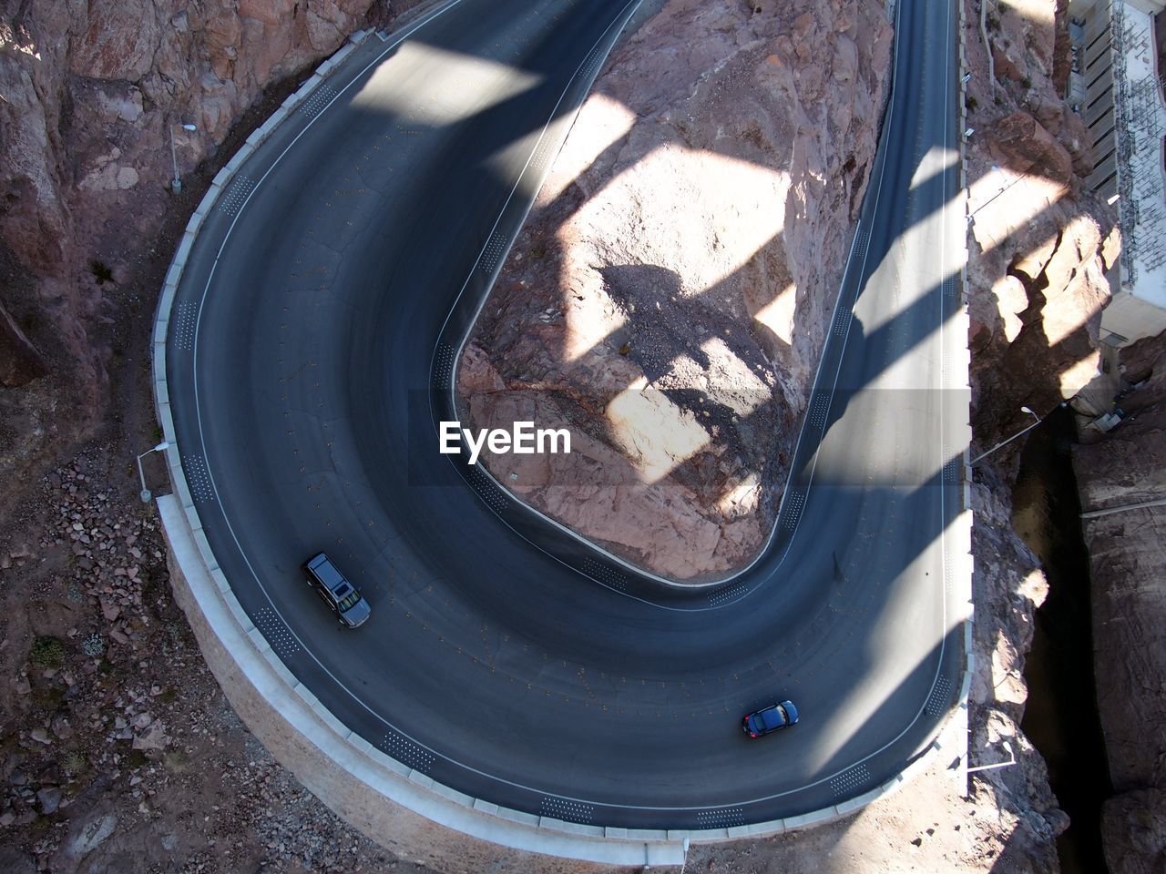 High angle view of cars on road amidst rock formation