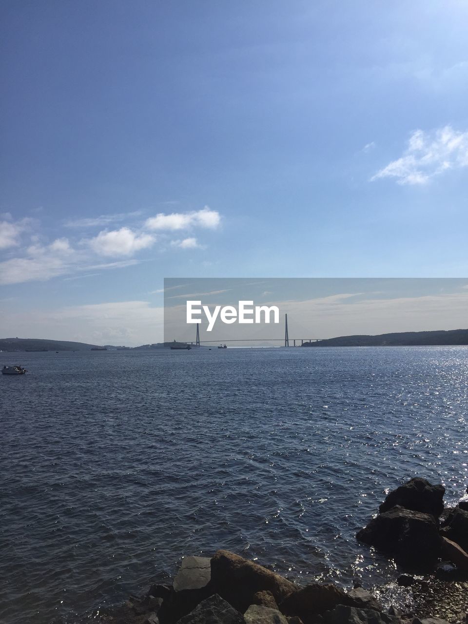 VIEW OF SEASCAPE AGAINST CLOUDY SKY