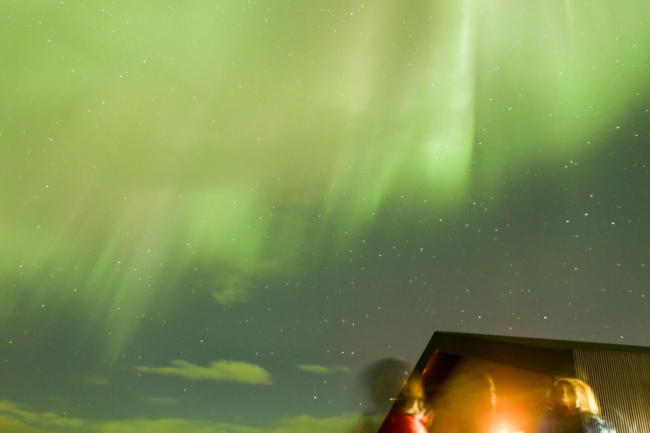 Low angle view of aurora borealis in night sky