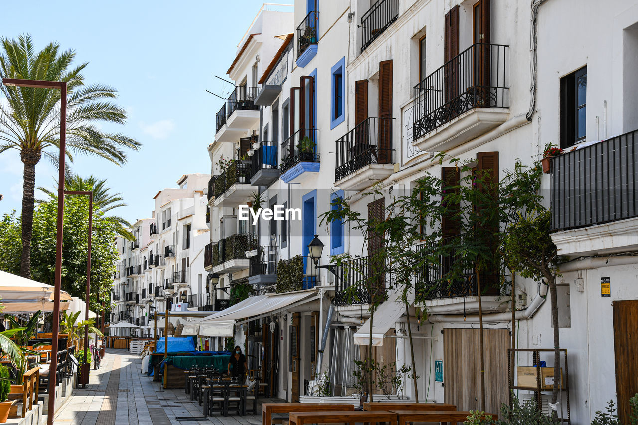 Residential building by street against sky. ibiza old town near the harbor