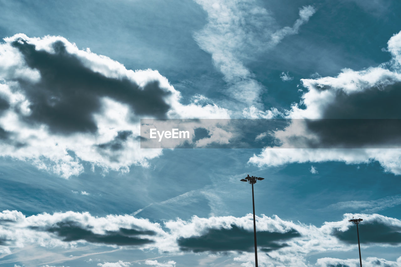 Low angle view of street light against sky