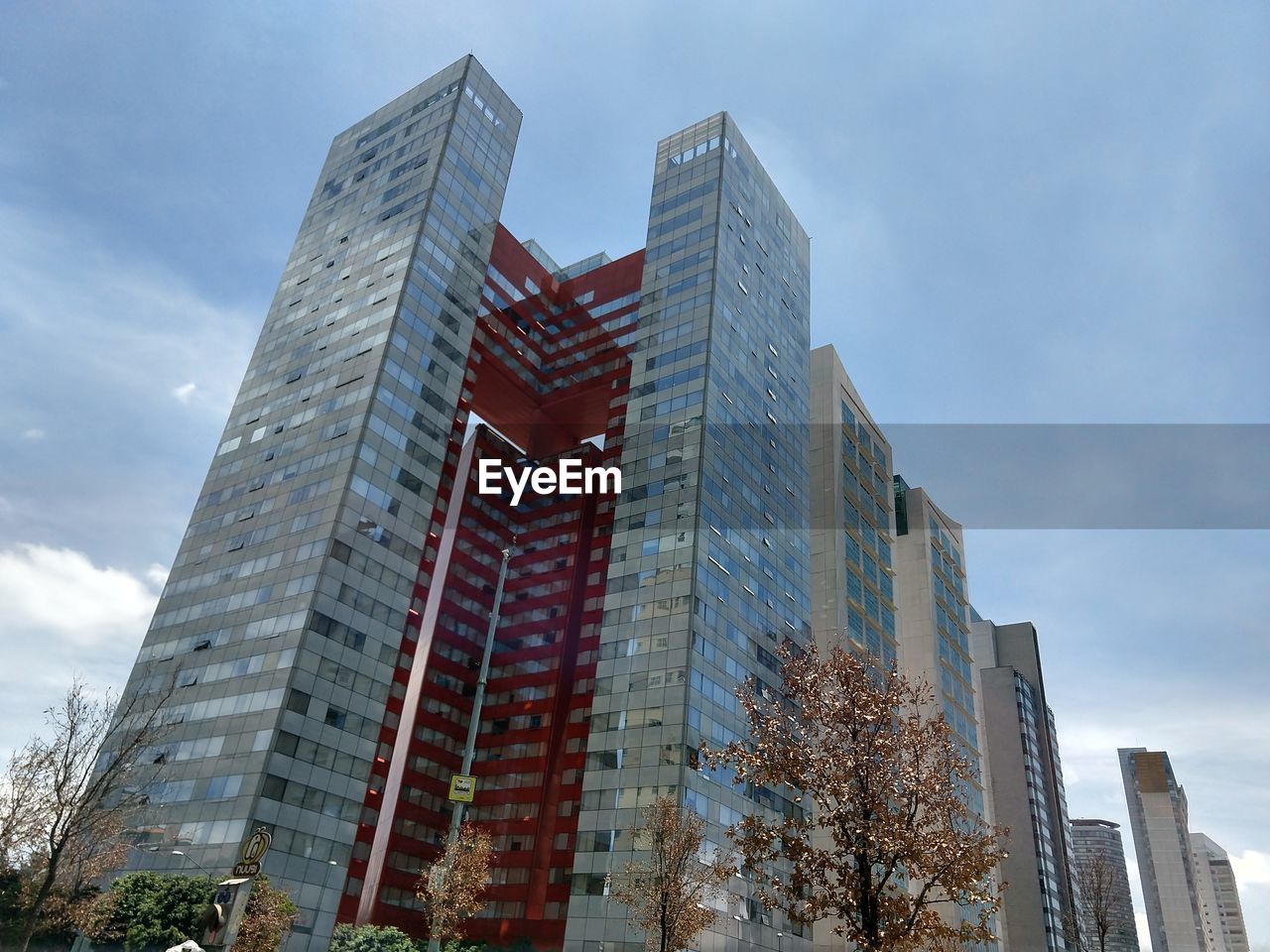 LOW ANGLE VIEW OF MODERN BUILDINGS AGAINST SKY