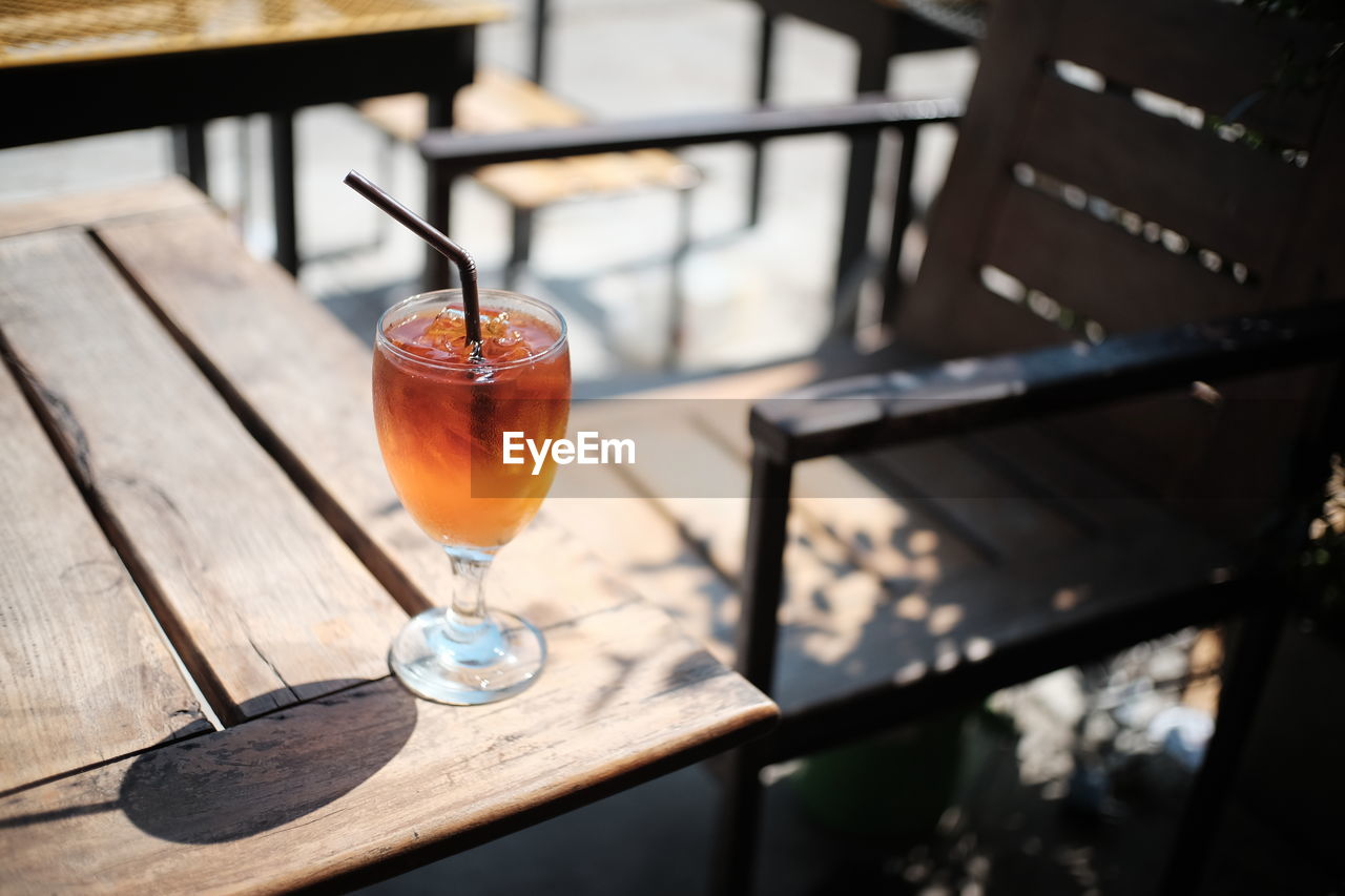 CLOSE-UP OF DRINK WITH GLASS OF JUICE