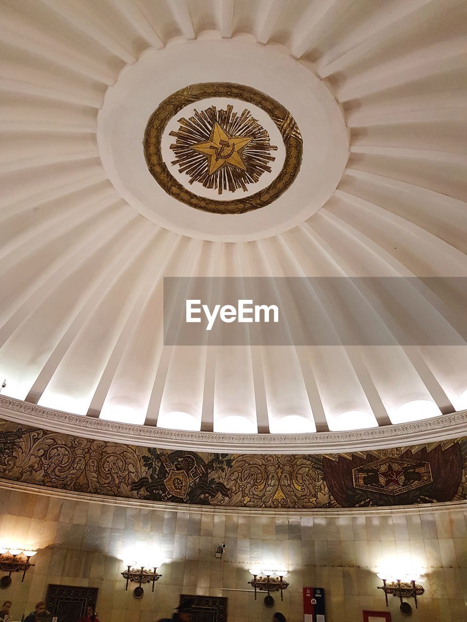 LOW ANGLE VIEW OF ILLUMINATED CEILING OF BUILDING IN TEMPLE