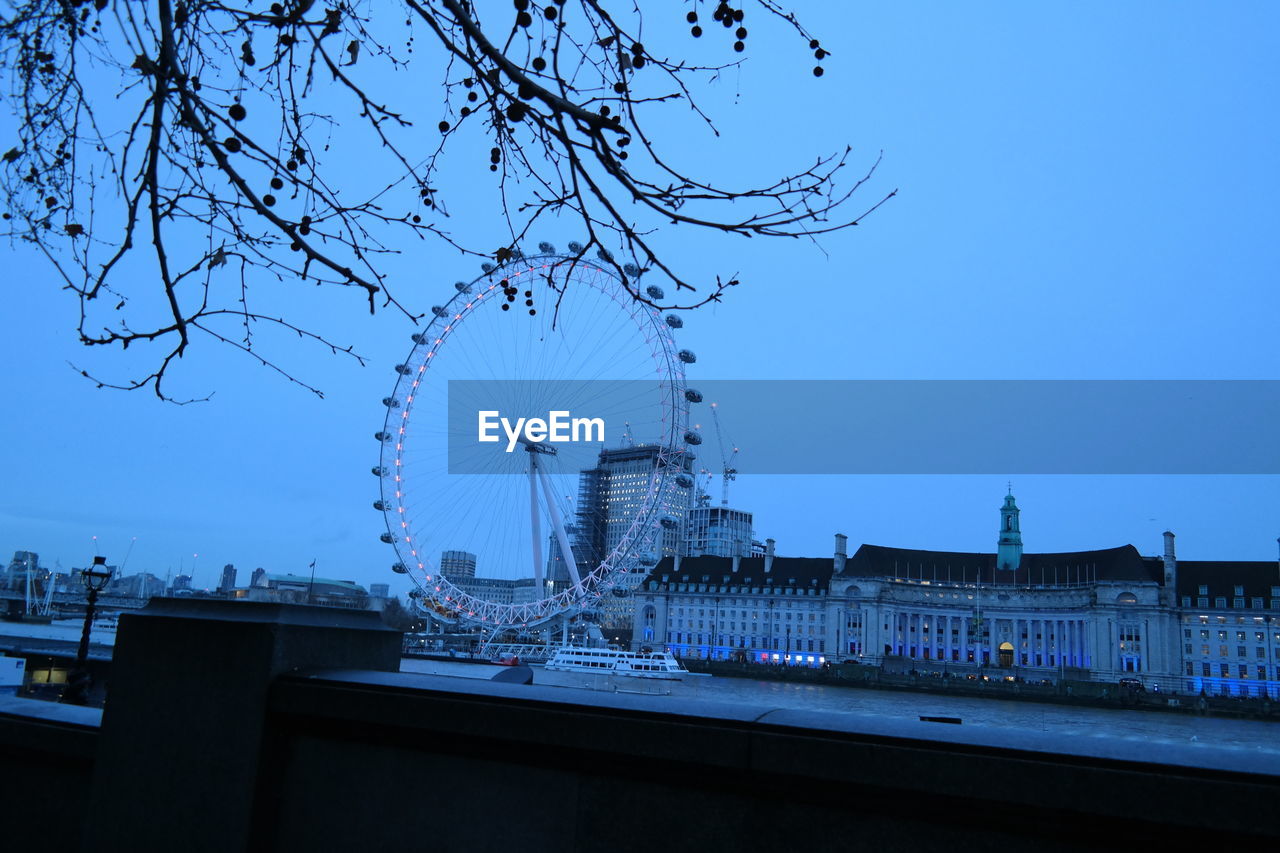 LOW ANGLE VIEW OF FERRIS WHEEL AGAINST CLEAR SKY