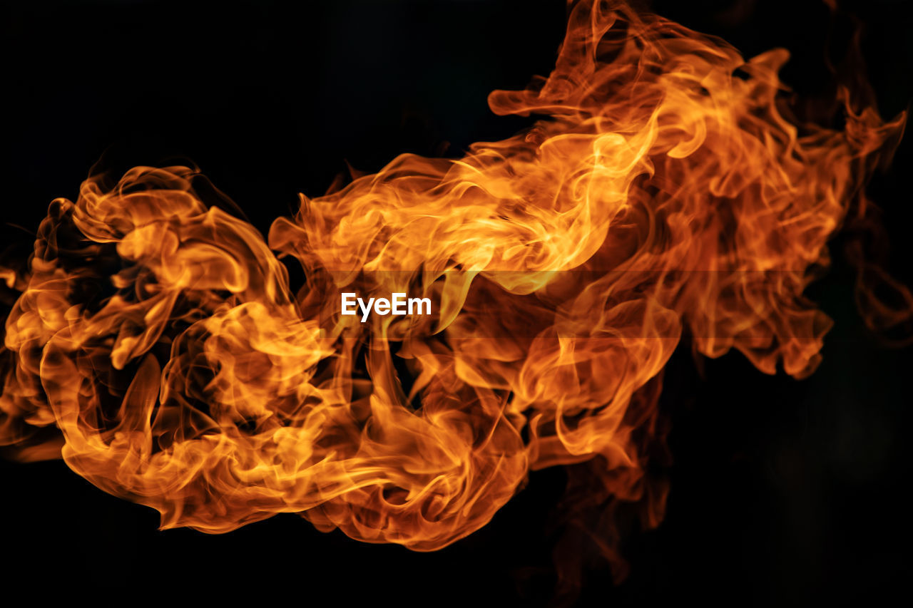 Close-up of fire against black background