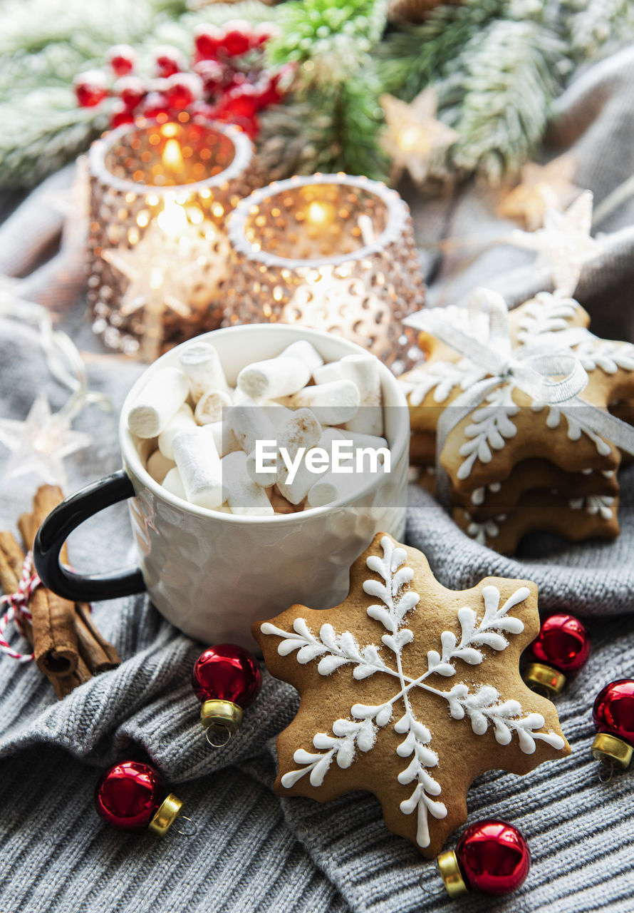 Christmas decorations, cocoa and gingerbread cookies. white wooden background.