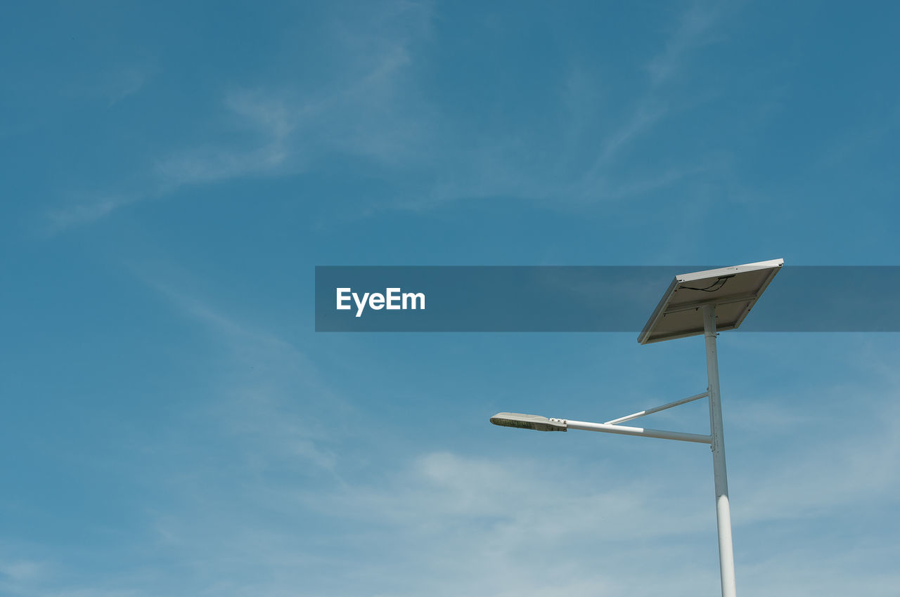 Low angle view of street light against sky