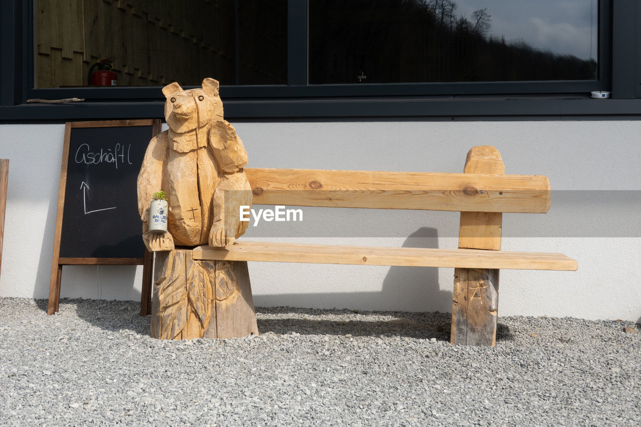 wood, furniture, sculpture, table, no people, seat, architecture, bench, representation, statue, day, nature, craft, human representation, art, creativity, outdoors