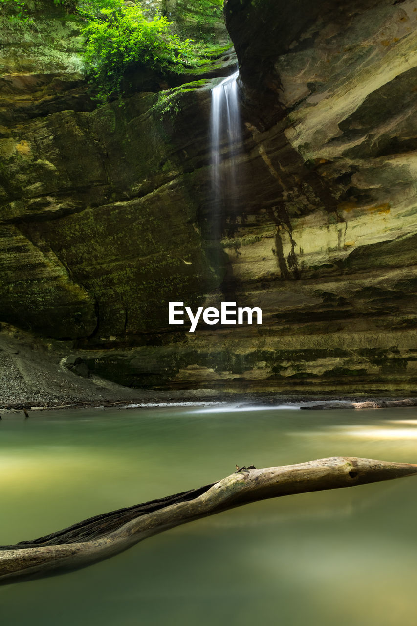 Scenic view of river flowing through rocks