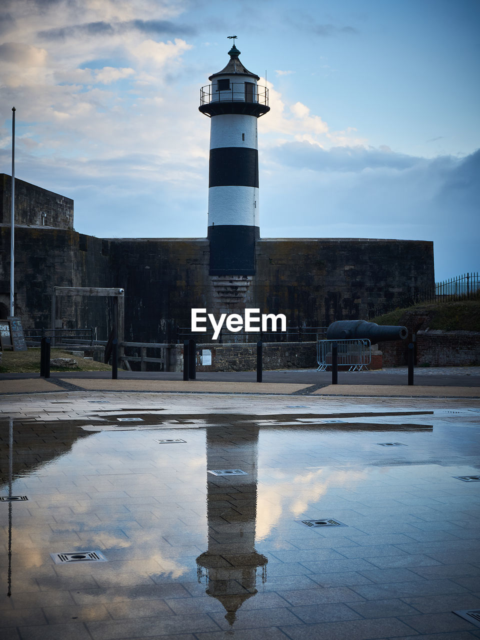 Amazing lighthouse captured featuring a reflection of the building.