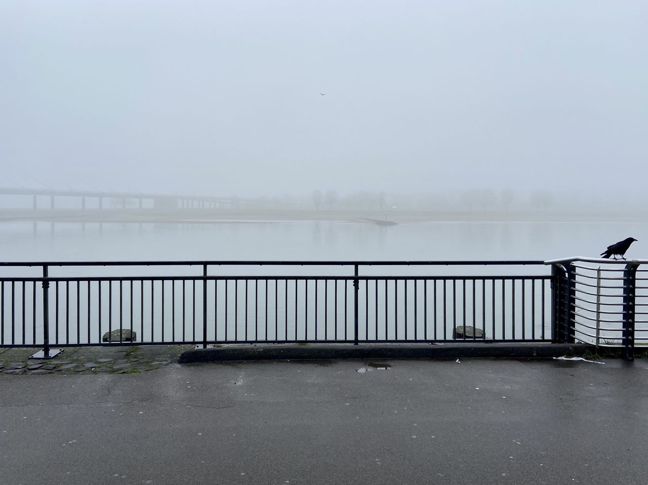 Bridge over sea against sky during rainy season