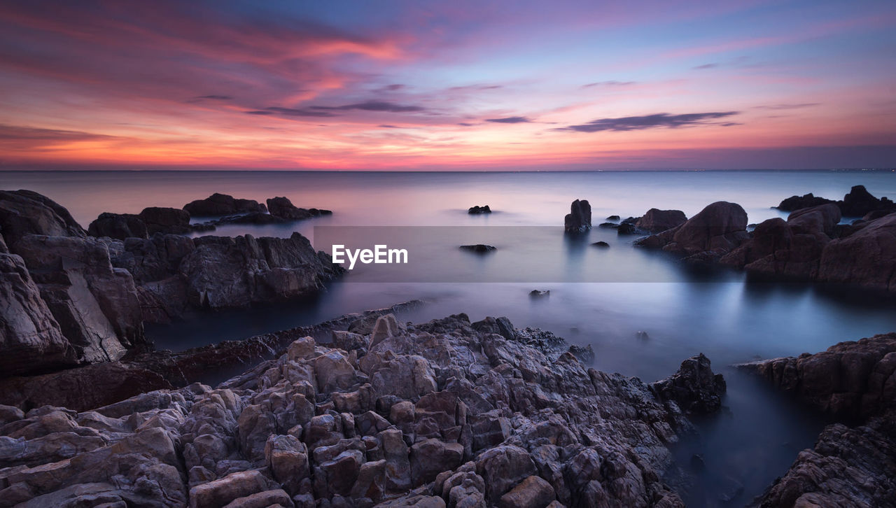 Panoramic view of sea against sky during sunset