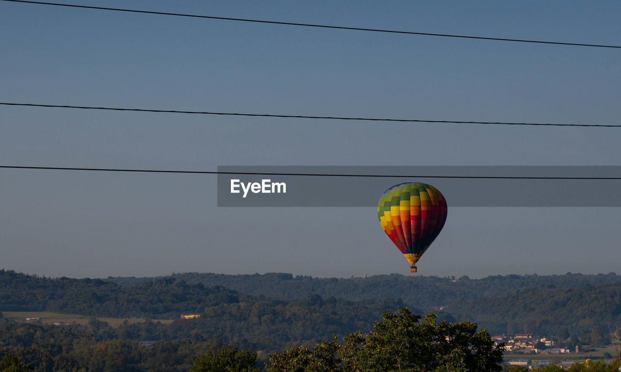 Low angle view of hot air balloon against clear sky