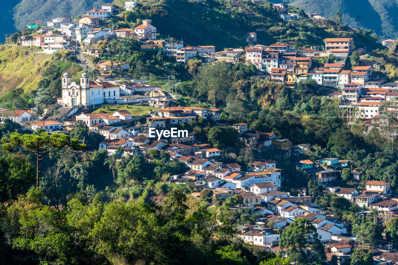 High angle view of townscape and trees in town