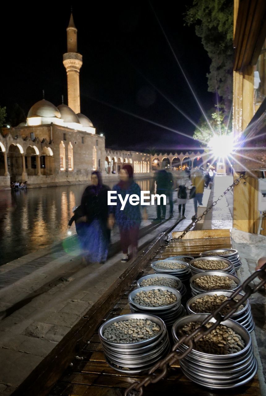 Blurred motion of people walking at mosque during night