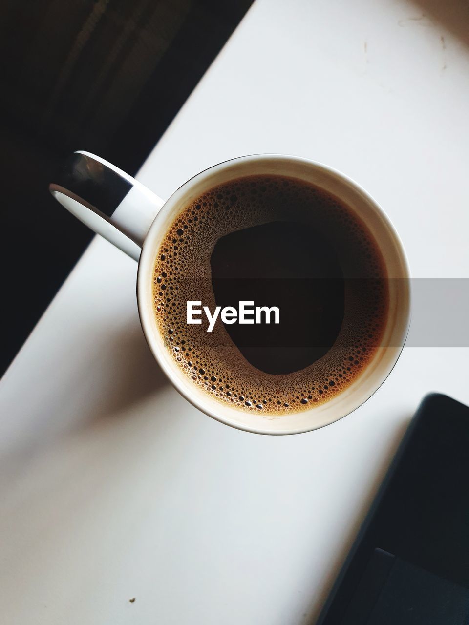 High angle view of coffee cup on table