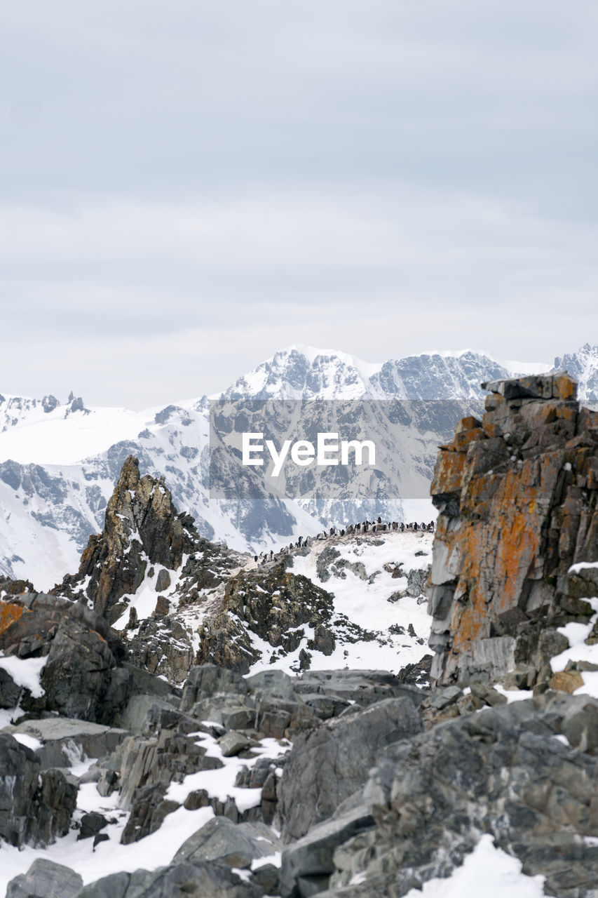 Scenic view of mountains against sky during winter