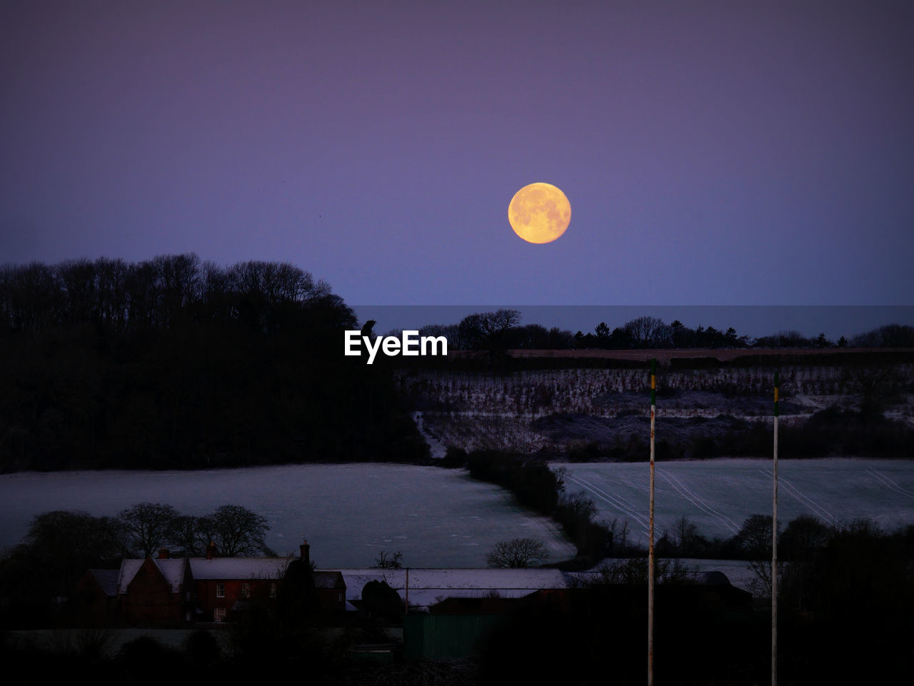 Scenic view of moon against clear sky at night