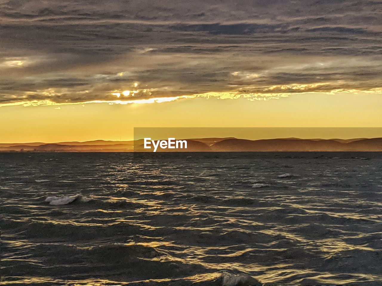 SCENIC VIEW OF SEA DURING SUNSET