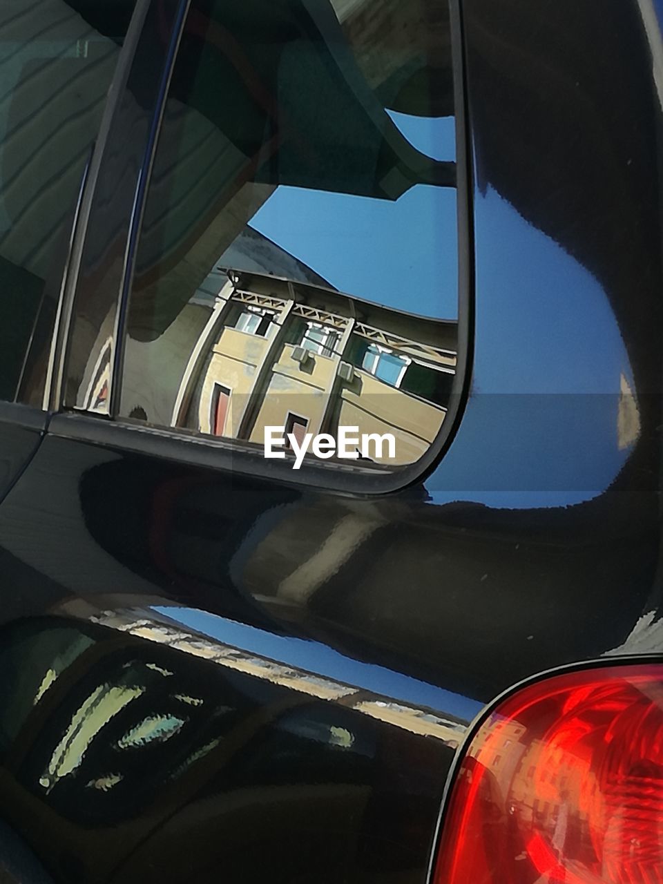 CLOSE-UP OF CAR ON SIDE-VIEW MIRROR
